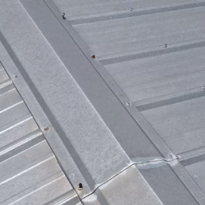 Exposed fasteners backing out of metal roof